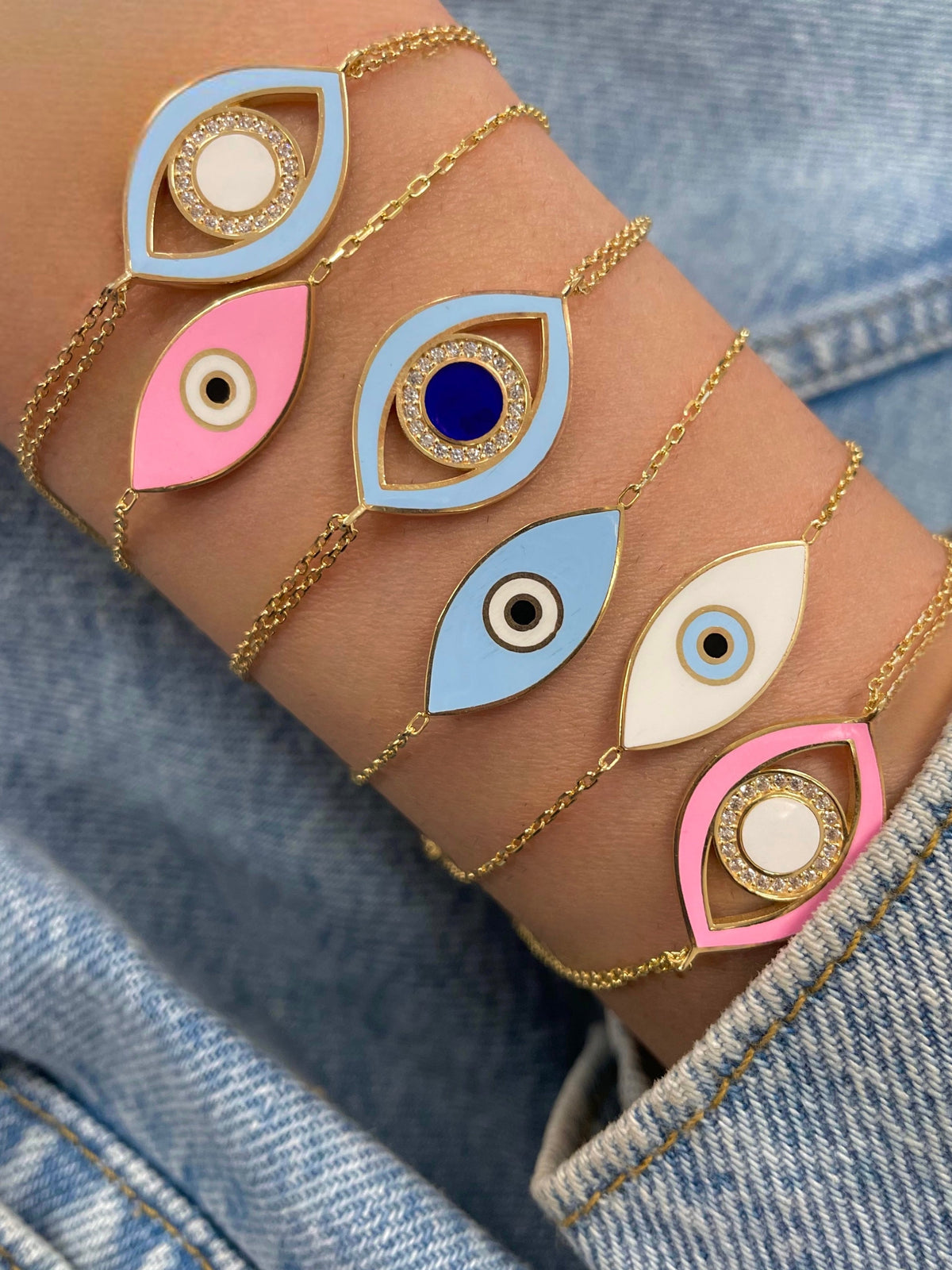 yellow gold double chained and light blue evil eye bracelet 